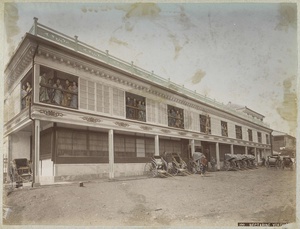 Sex workers in the gallery of the brothel Nectarine in Yokohama with rickshaw drivers in front of it