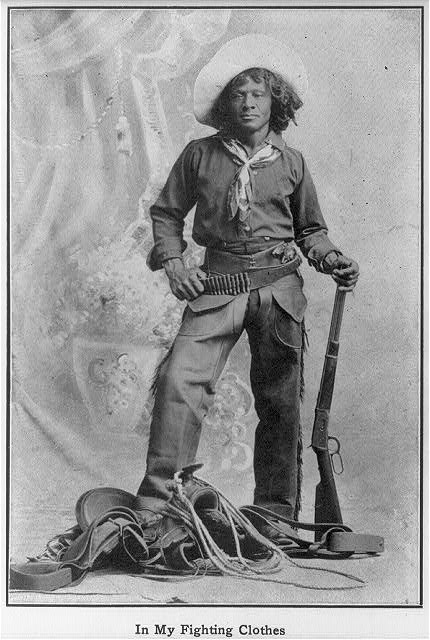  Nat “Deadwood Dick” Love poses in front of a studio backdrop in this black and white photograph. He