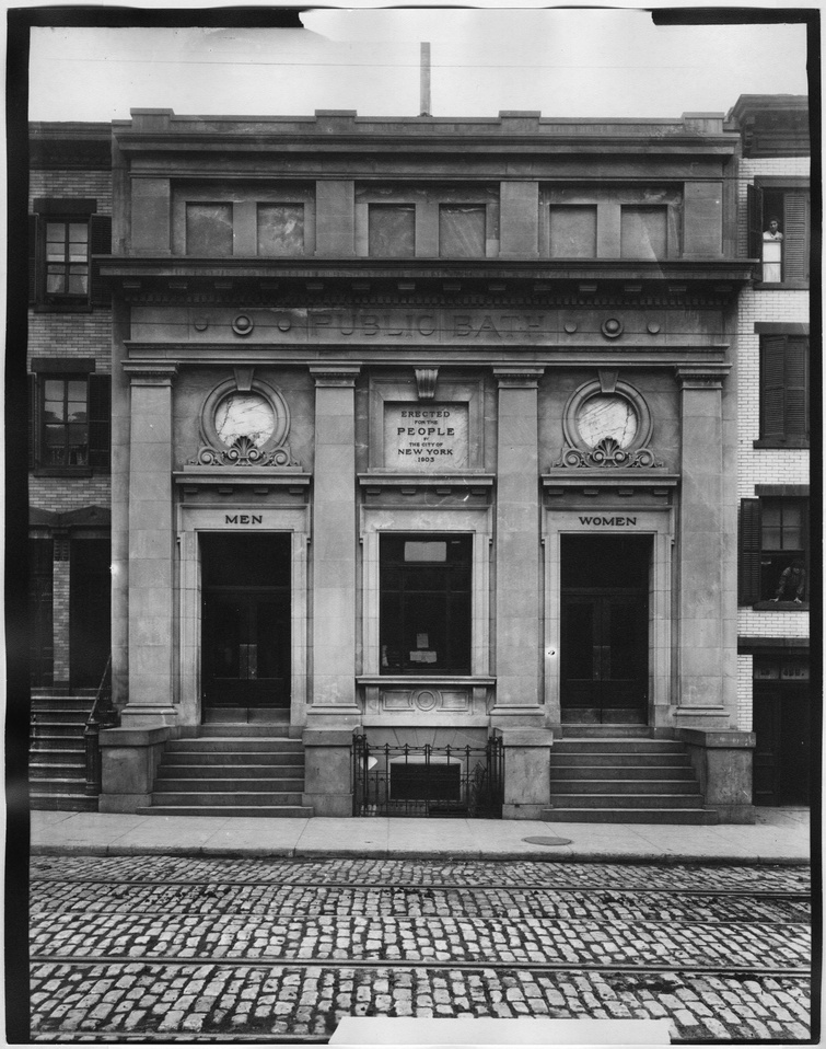 A black and white photograph of an unidentified building facade in Manhattan. The entablature reads: