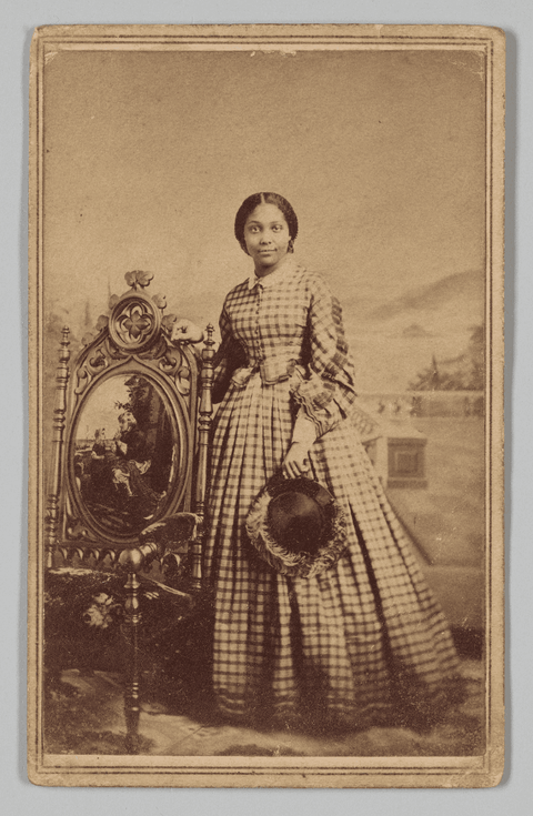 A sepia tone carte-de-visite of a young woman, captured at the Ball & Thomas Photographic Art Galler