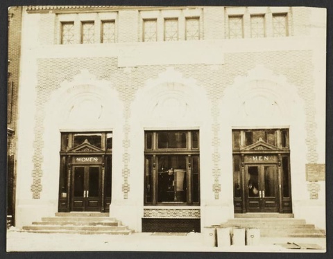 A photograph of the Montrose Avenue Bath House. There are two separate entrances with stairs leading