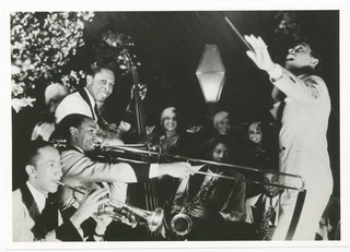 Print of Cab Calloway conducting his band, 1930s, American
