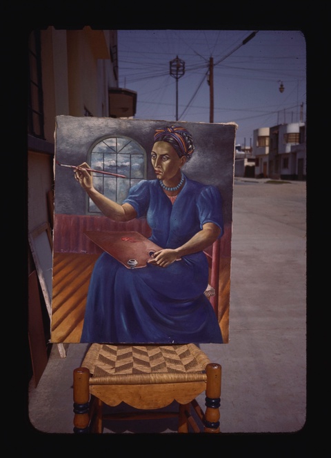 A photograph of a painting leaning against a chair on an empty city street. The painting depicts a s