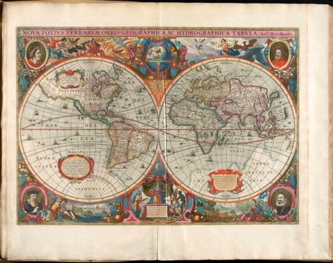 An illuminated map of the Earth shown as two connected spheres.