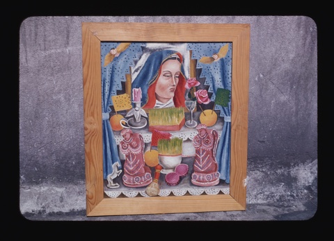 A photograph of a painting in a light-colored wood frame leaning against a gray concrete or stone wa