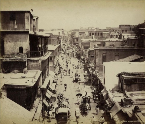 This photo shows a Calcutta bazaar significantly different from the typical MENA bazaar, with a wide