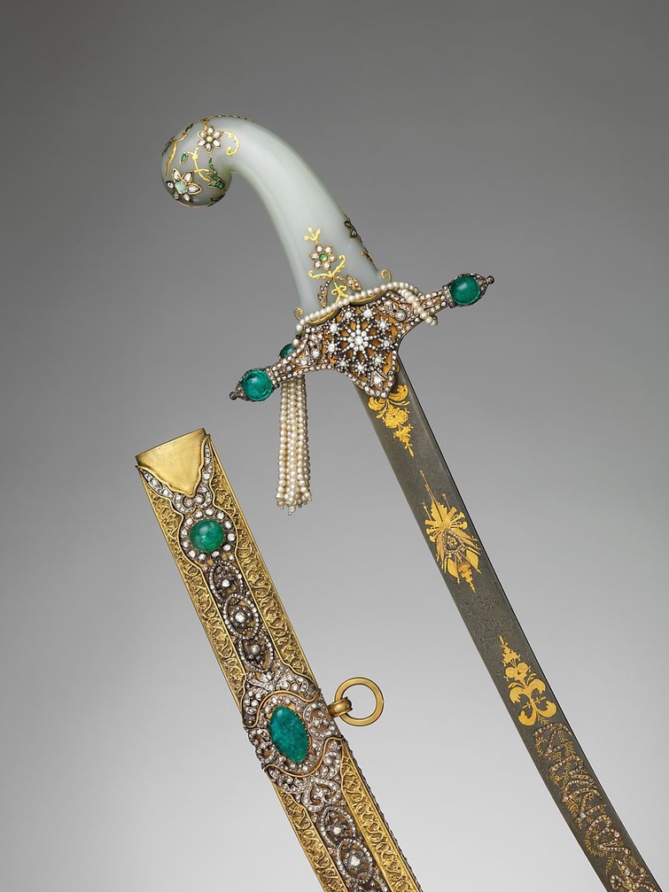 An Indian and Turkish saber with scabbard. The jade hilt and gold sheath are encrusted with diamonds